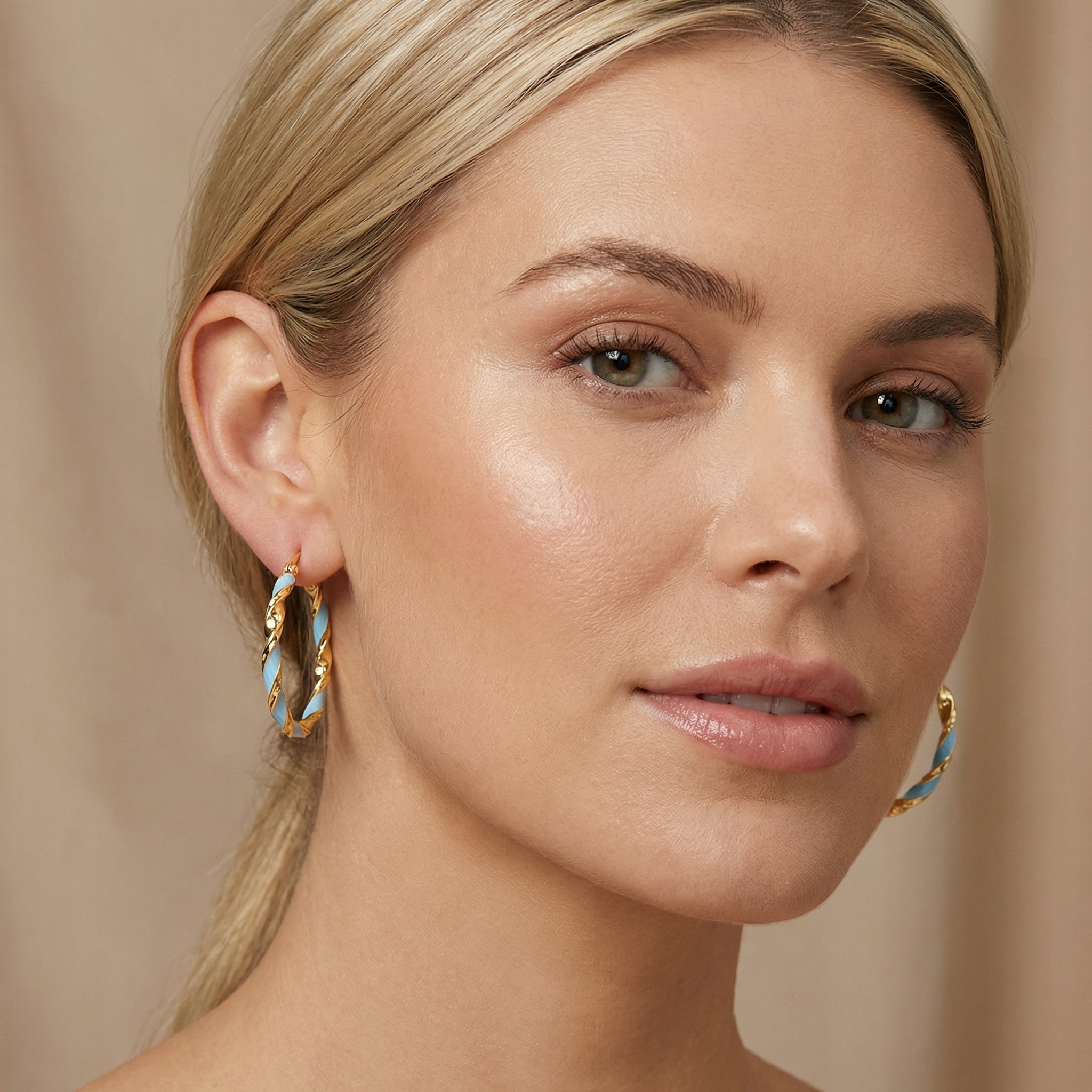 Large sky blue and gold spiral hoop earrings close up