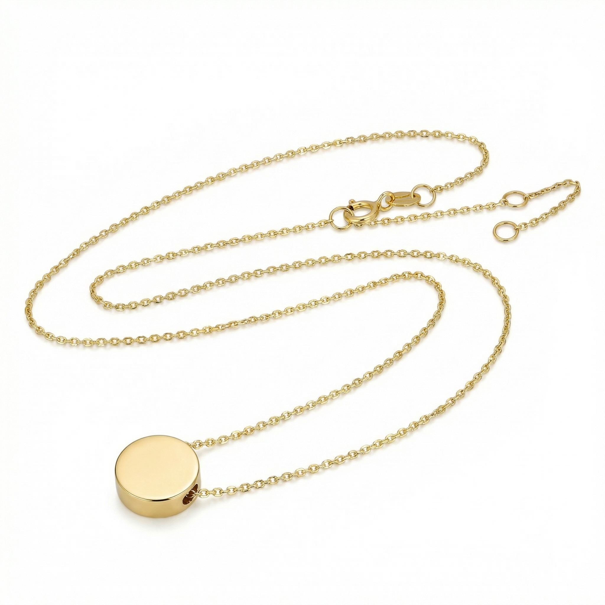Gold necklace with a round pendant on a white background