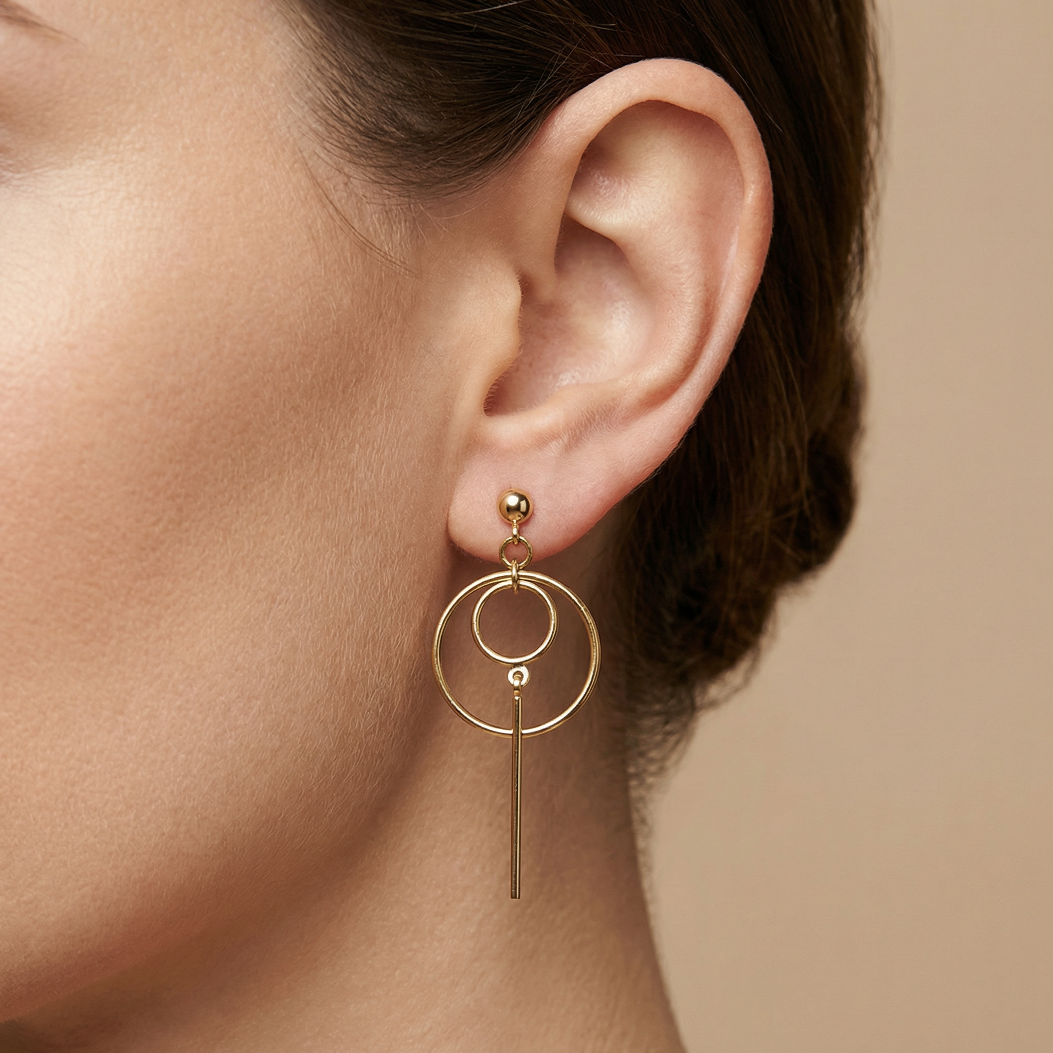 High polish 14k gold structural earrings featuring circles and bars