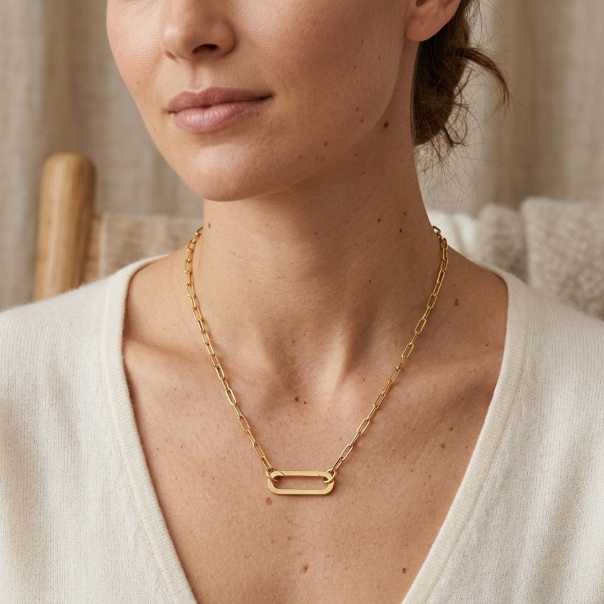 High-polish 14k gold statement necklace featuring carabiner focal point
