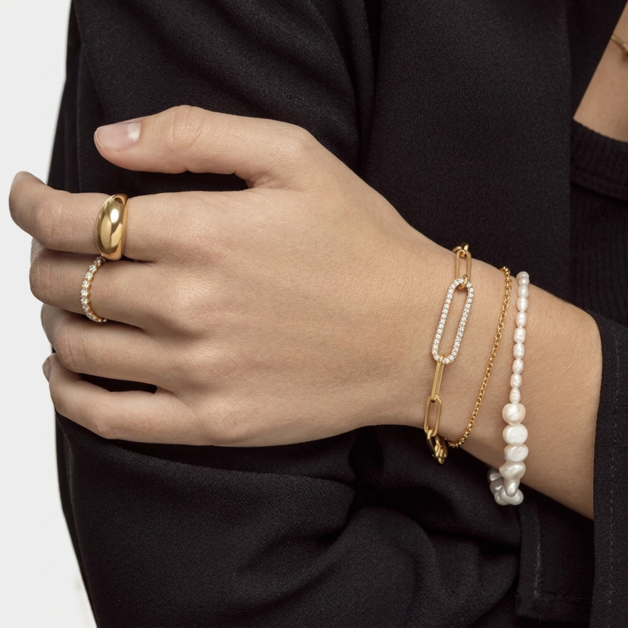 High polish 14k gold elongated link bracelet on white background
