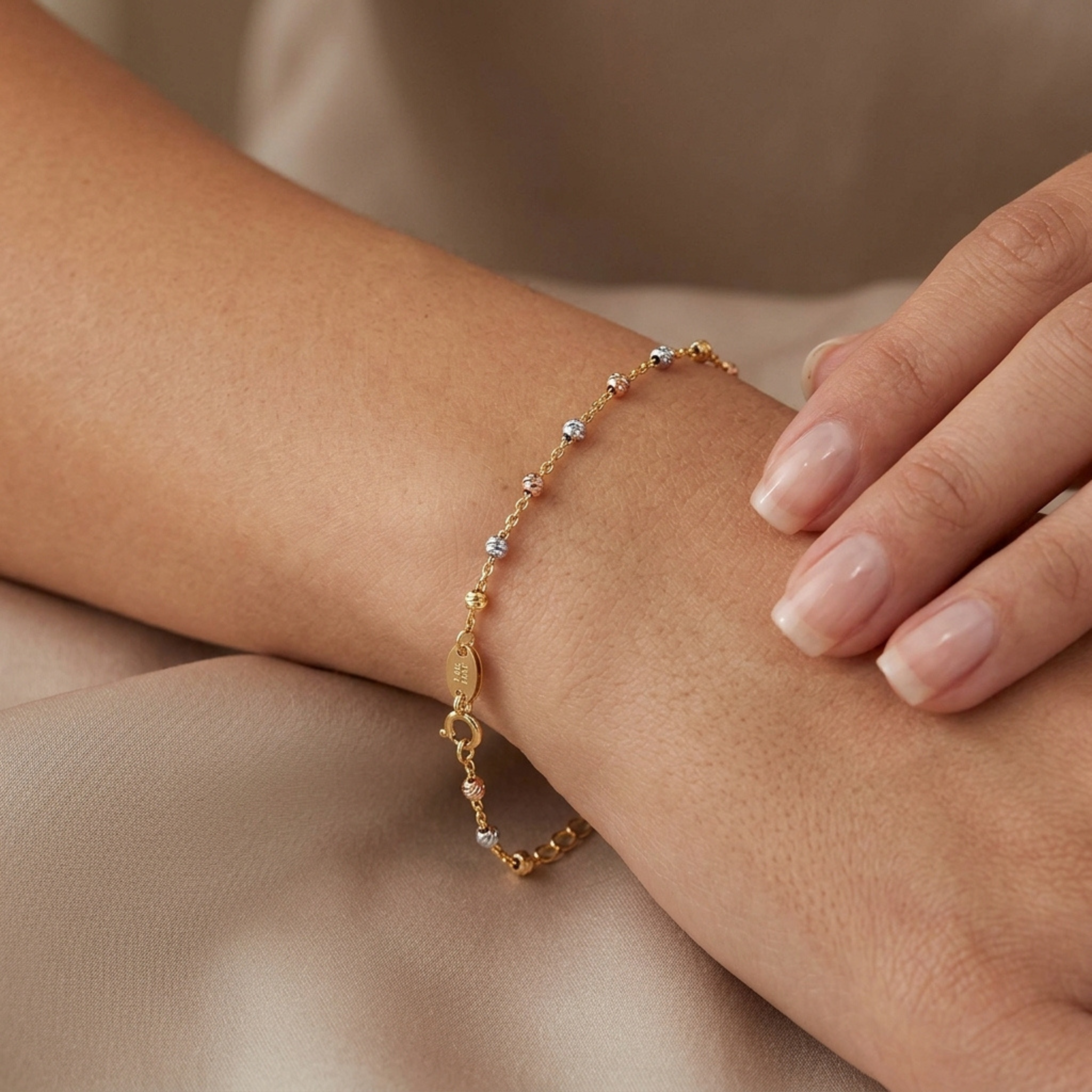 Shimmering diamond-cut gold station bracelet in mixed gold tones