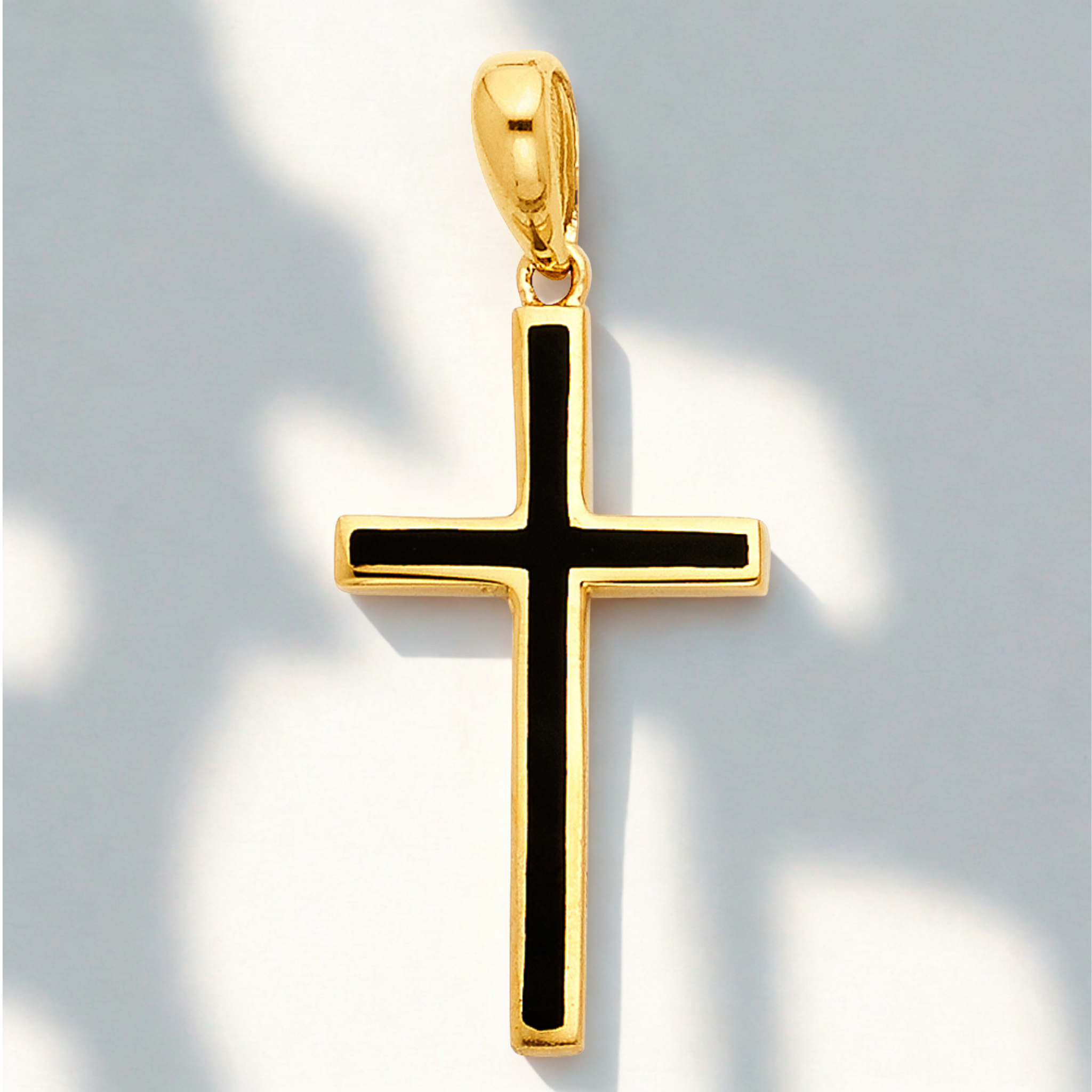 High-polish 14k gold cross with high-contrast black center