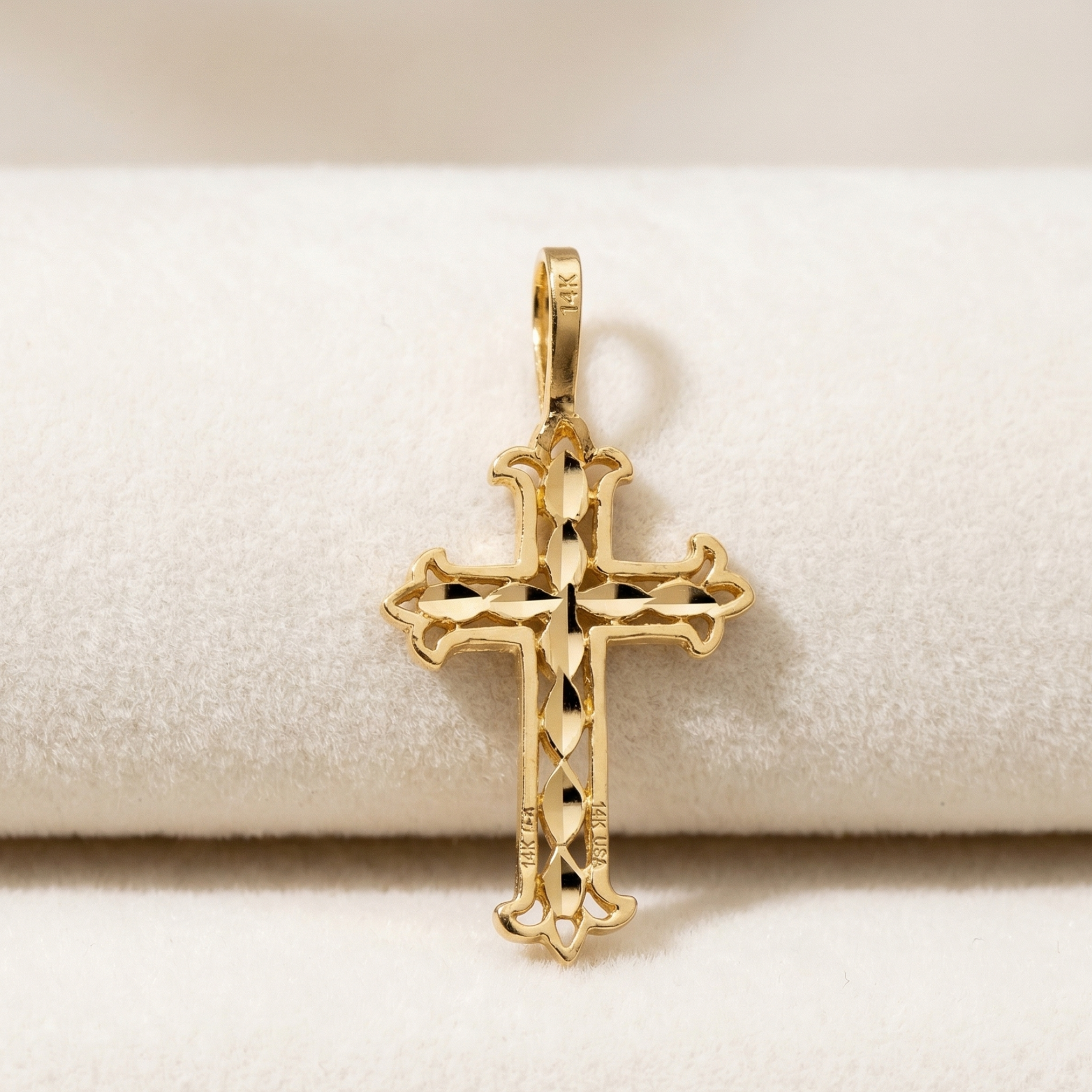 High-polish 14k gold religious pendant with faceted shimmering center