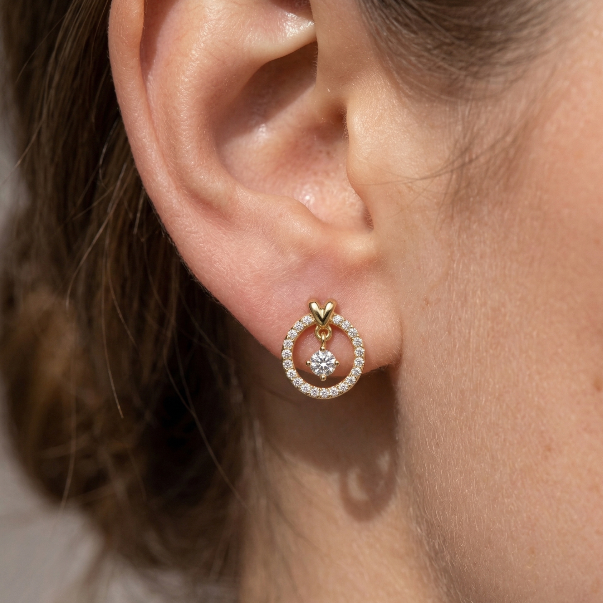 High-polish 14k gold earrings with suspended center drop detail