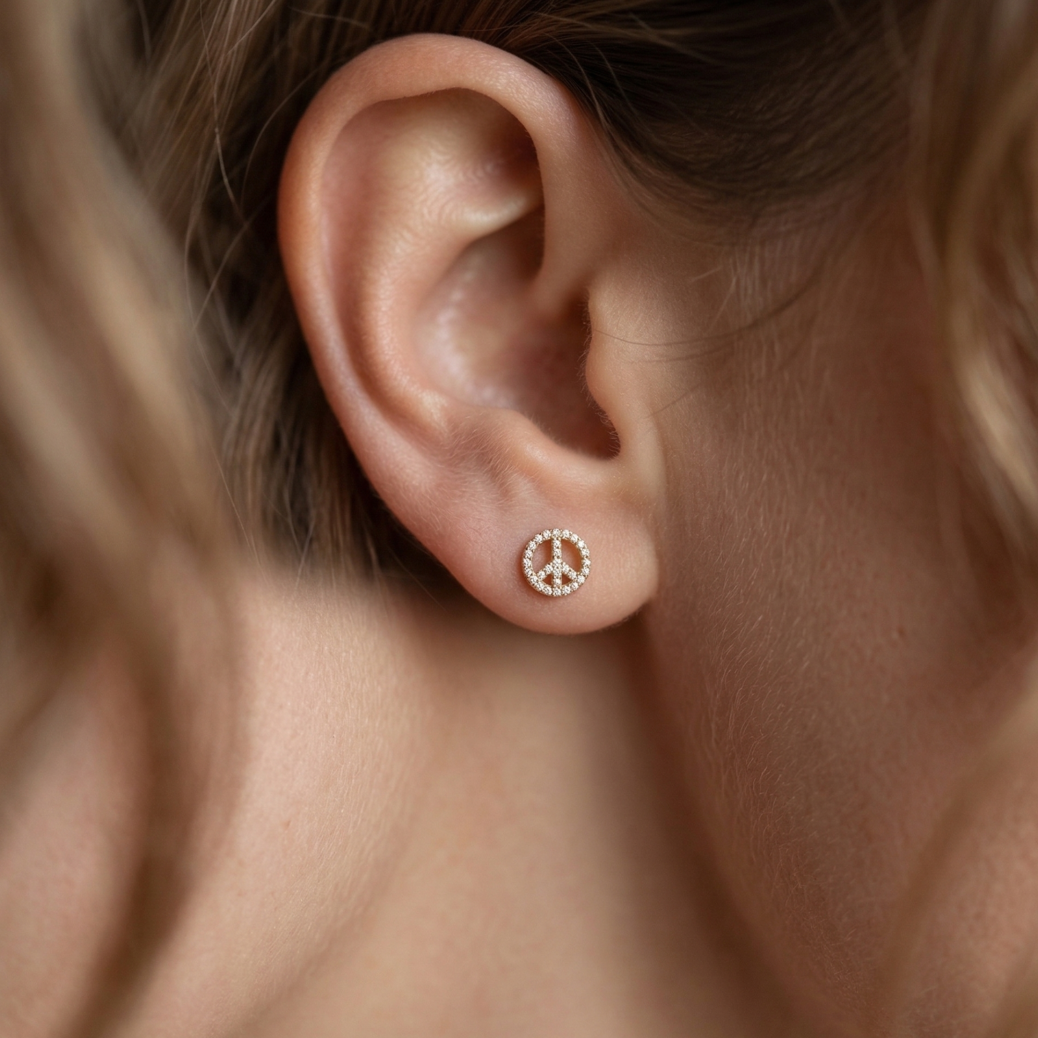 Dainty yellow gold peace symbol studs 8mm height front view