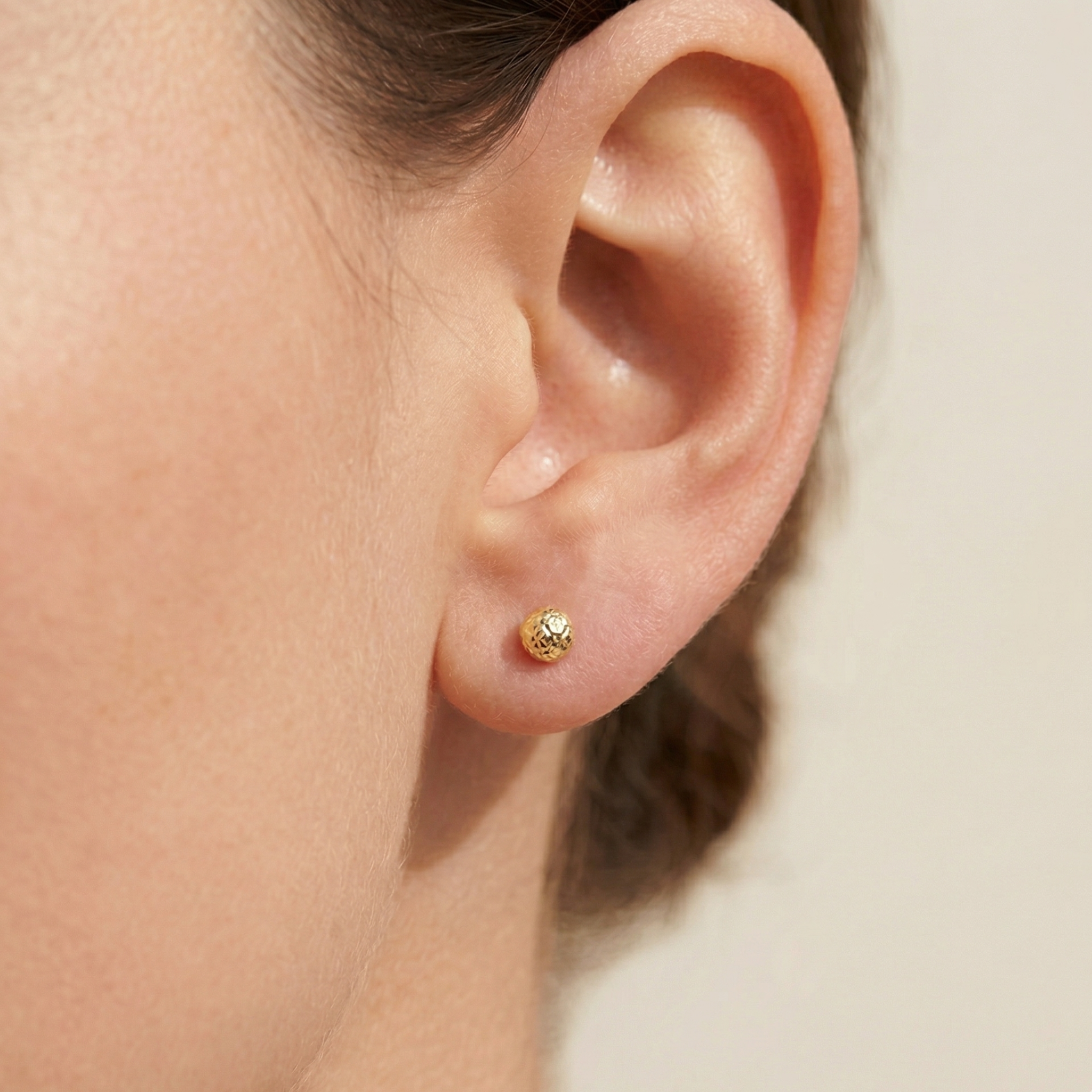 Textured gold sphere studs 6mm diameter front view