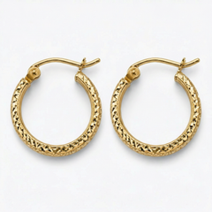 Gold hoop earrings with intricate designs on a white background