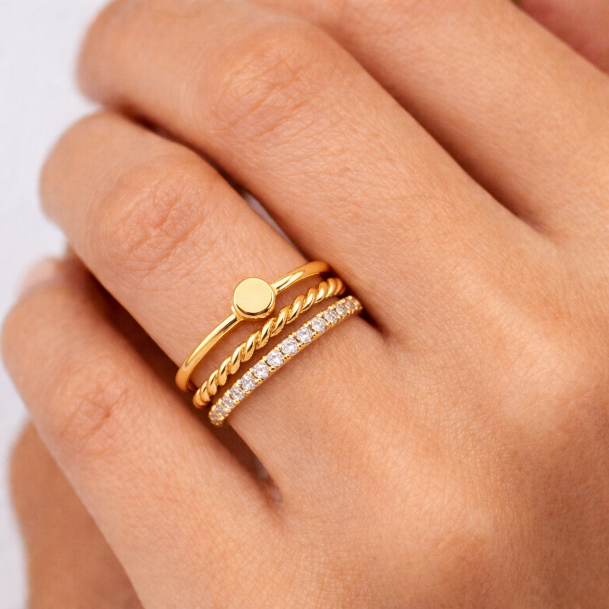 close up 14k solid gold engravable disc ring polished yellow gold minimalist signet ring