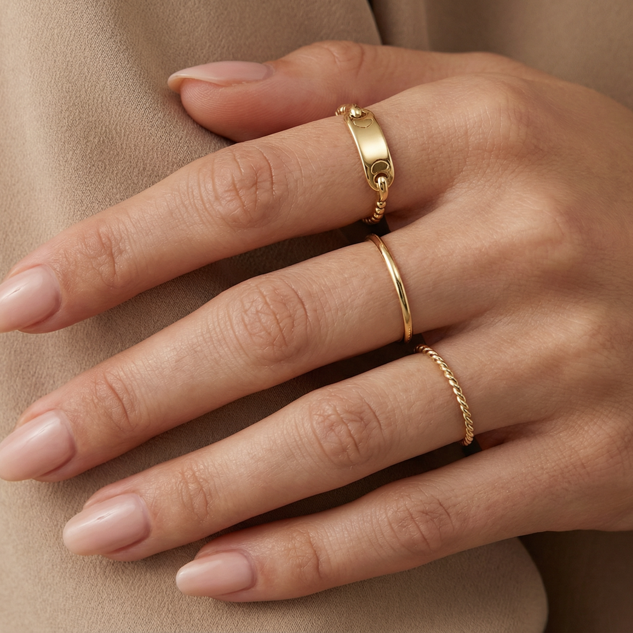 Minimalist 14k solid gold bar ring with a textured beaded band worn on a woman's hand, styled for a "quiet luxury" aesthetic, dainty gold jewelry.