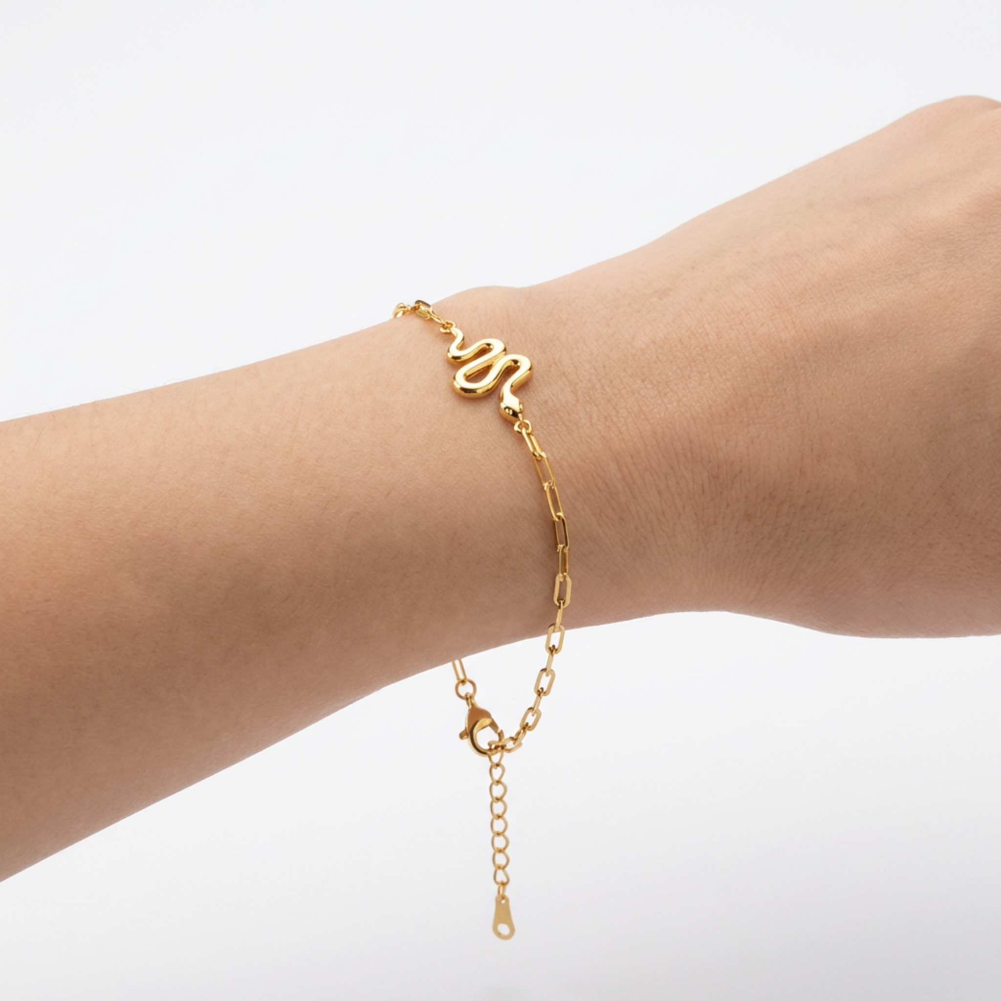 Dainty 14K yellow gold snake bracelet lifestyle wrist shot