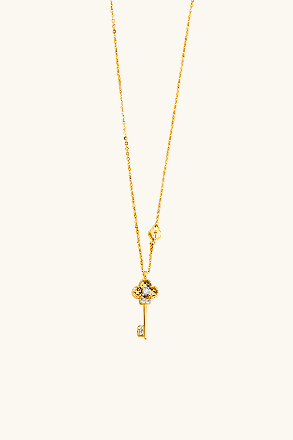 14k solid gold key pendant necklace close up with delicate chain