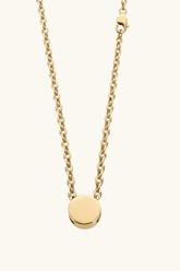 Gold necklace with a round pendant on a white background