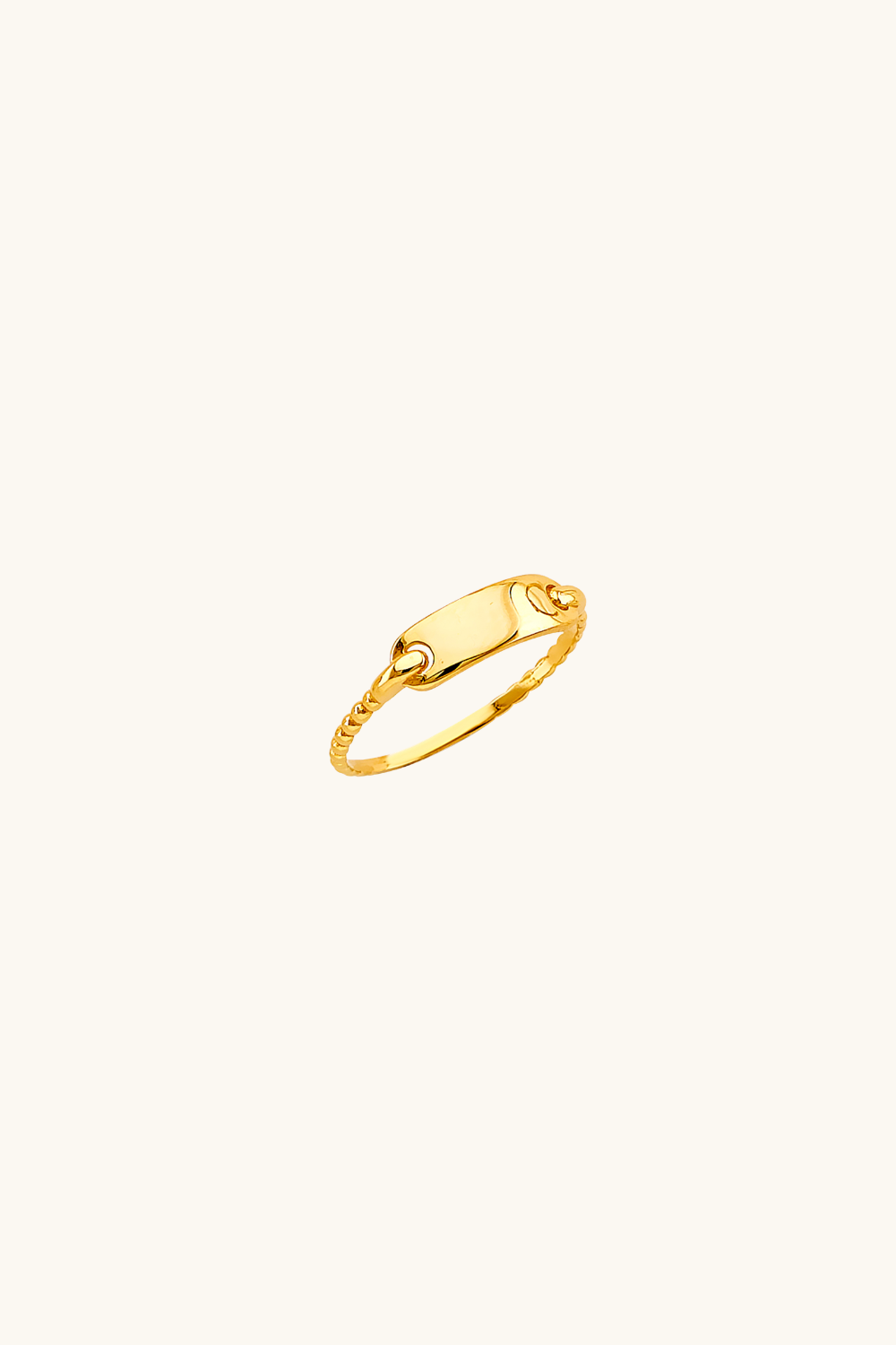 Top-down view of a curated 14k gold ring stack on a female index finger featuring a gold disc ring, a chevron V-band, a twisted rope ring, and a gold chain link band.