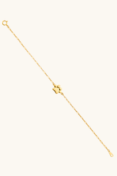 14K solid gold paw charm paperclip chain bracelet on wrist