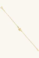 14K solid gold snake charm bracelet on female wrist paperclip chain