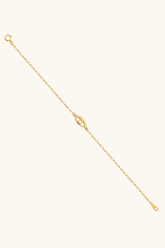 14k solid gold evil eye bracelet on female wrist, minimal open eye design no stone
