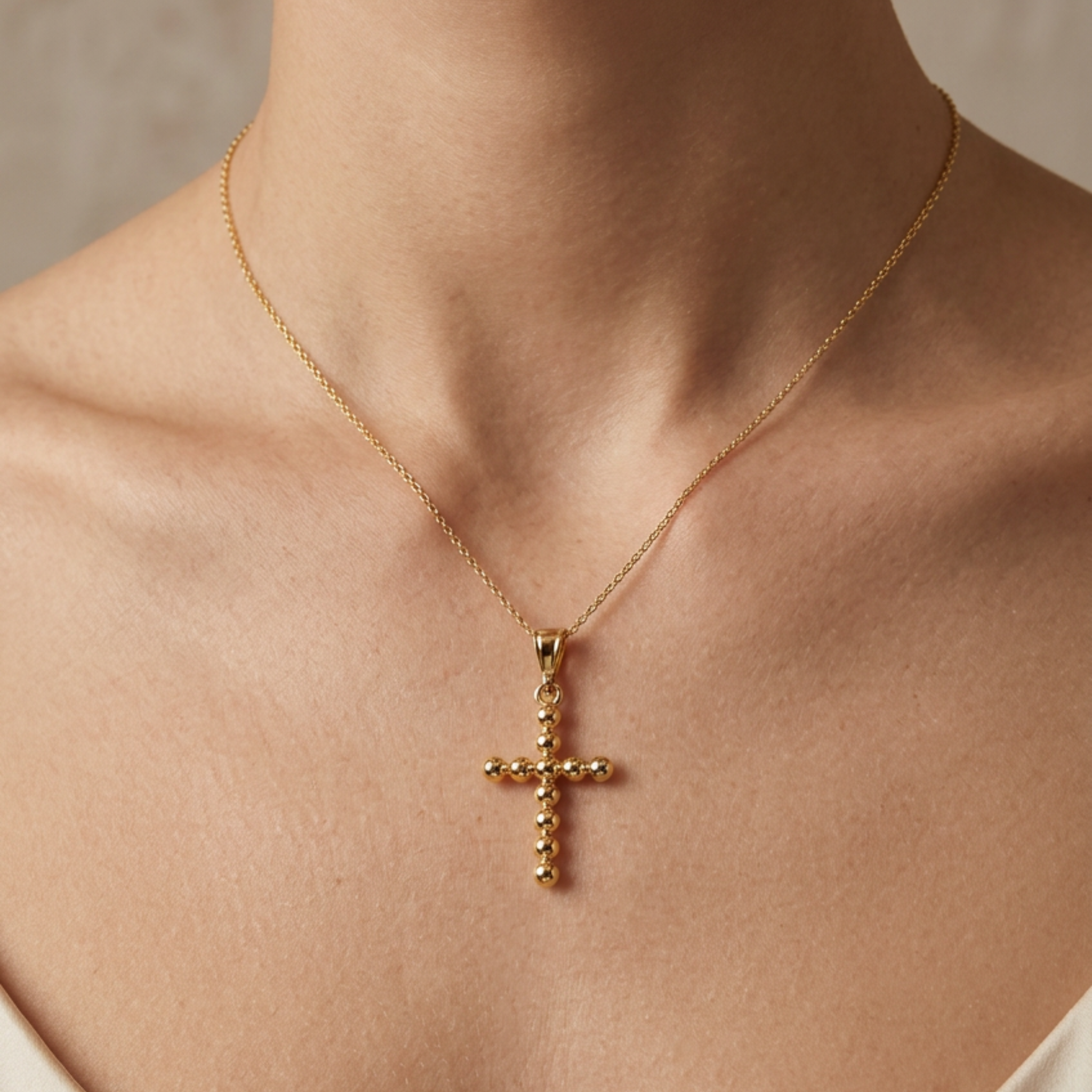 High-polish 14k gold religious pendant with spherical bead design