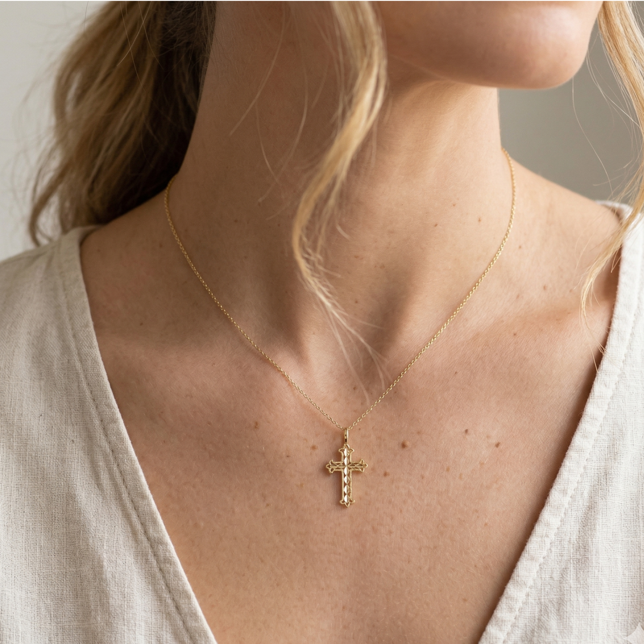 Dainty Gothic-style gold cross charm 15mm height front view