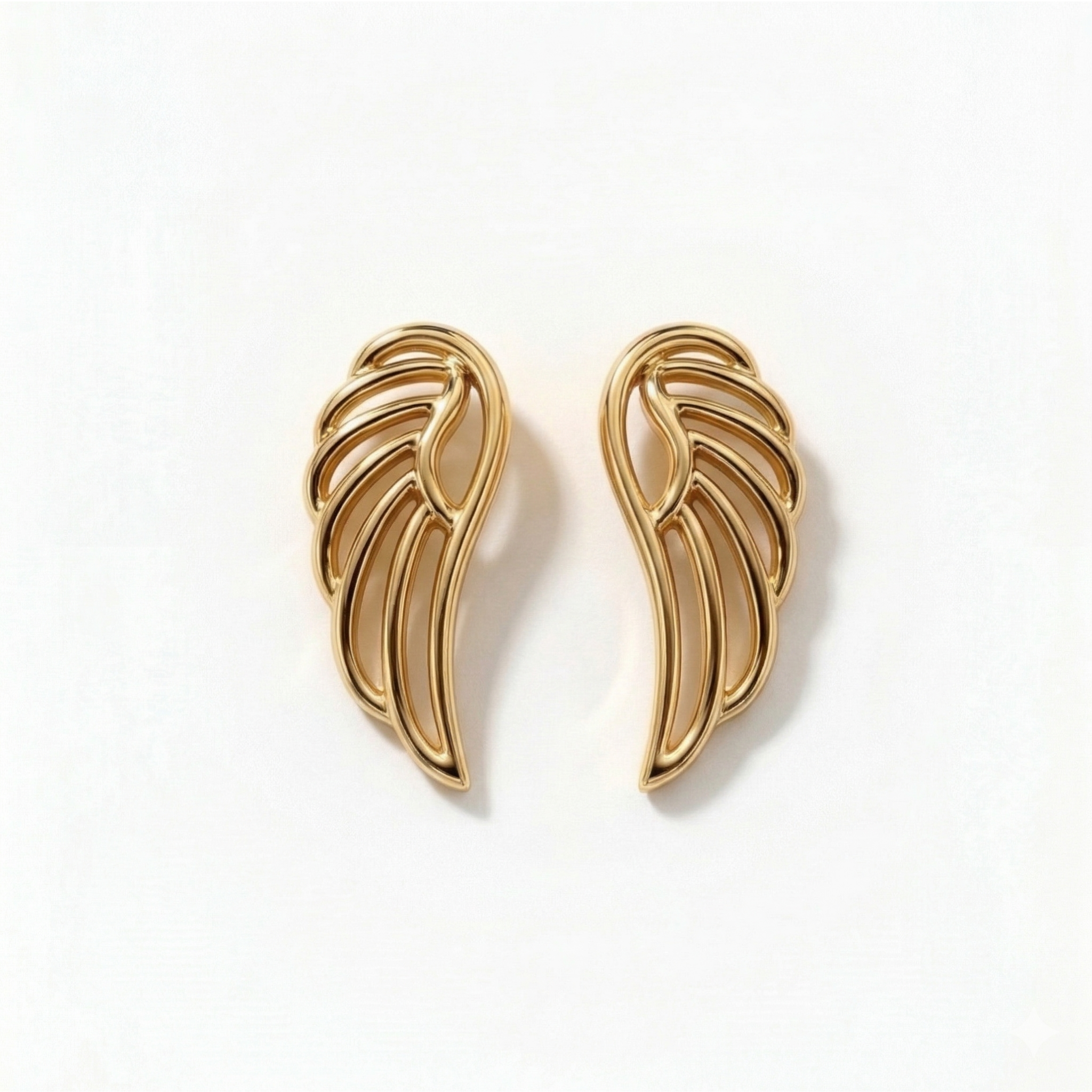 Small 14k yellow gold minimalist wing studs for curated ear mapping