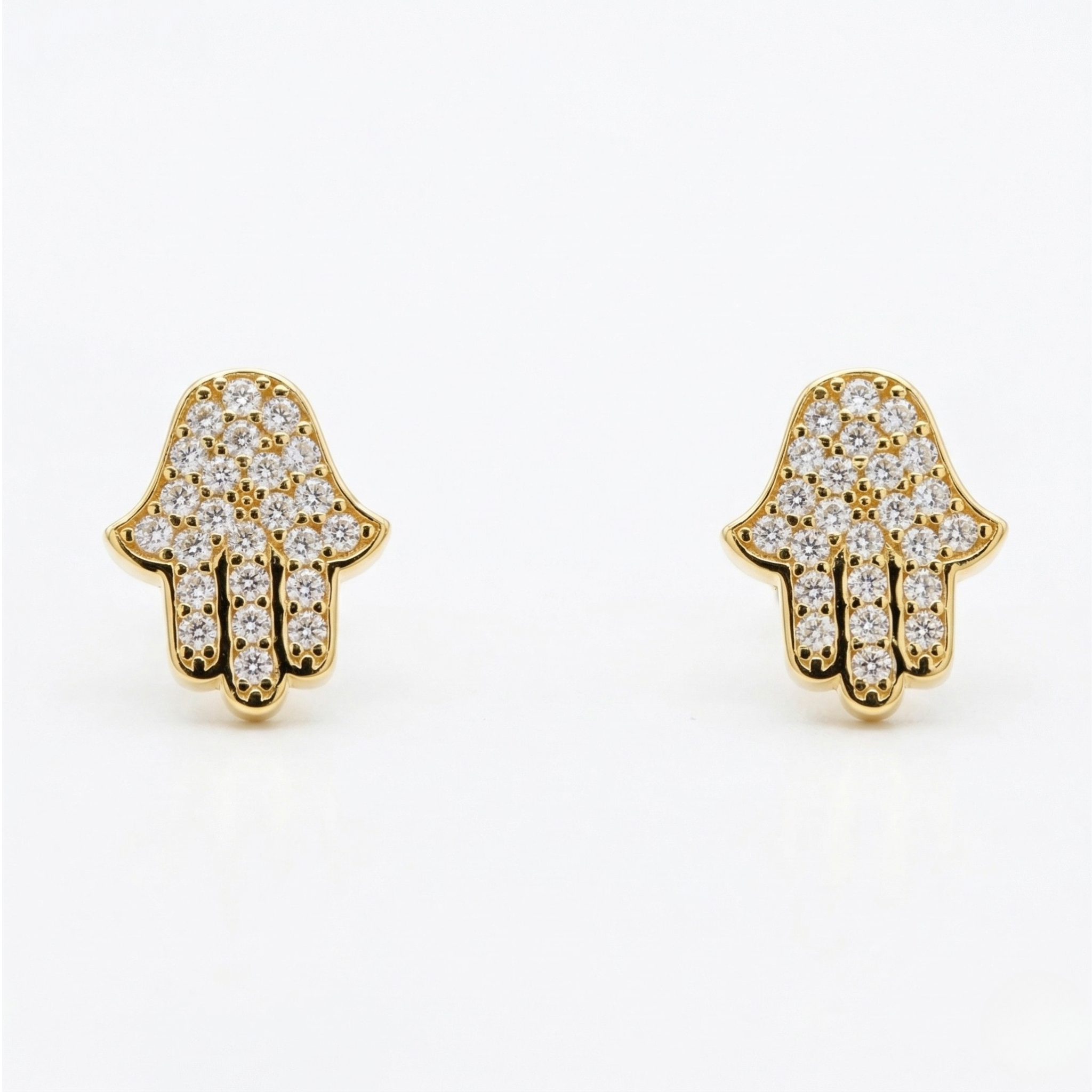 High-polish 14k gold symbolic earrings with shimmering detail on white background