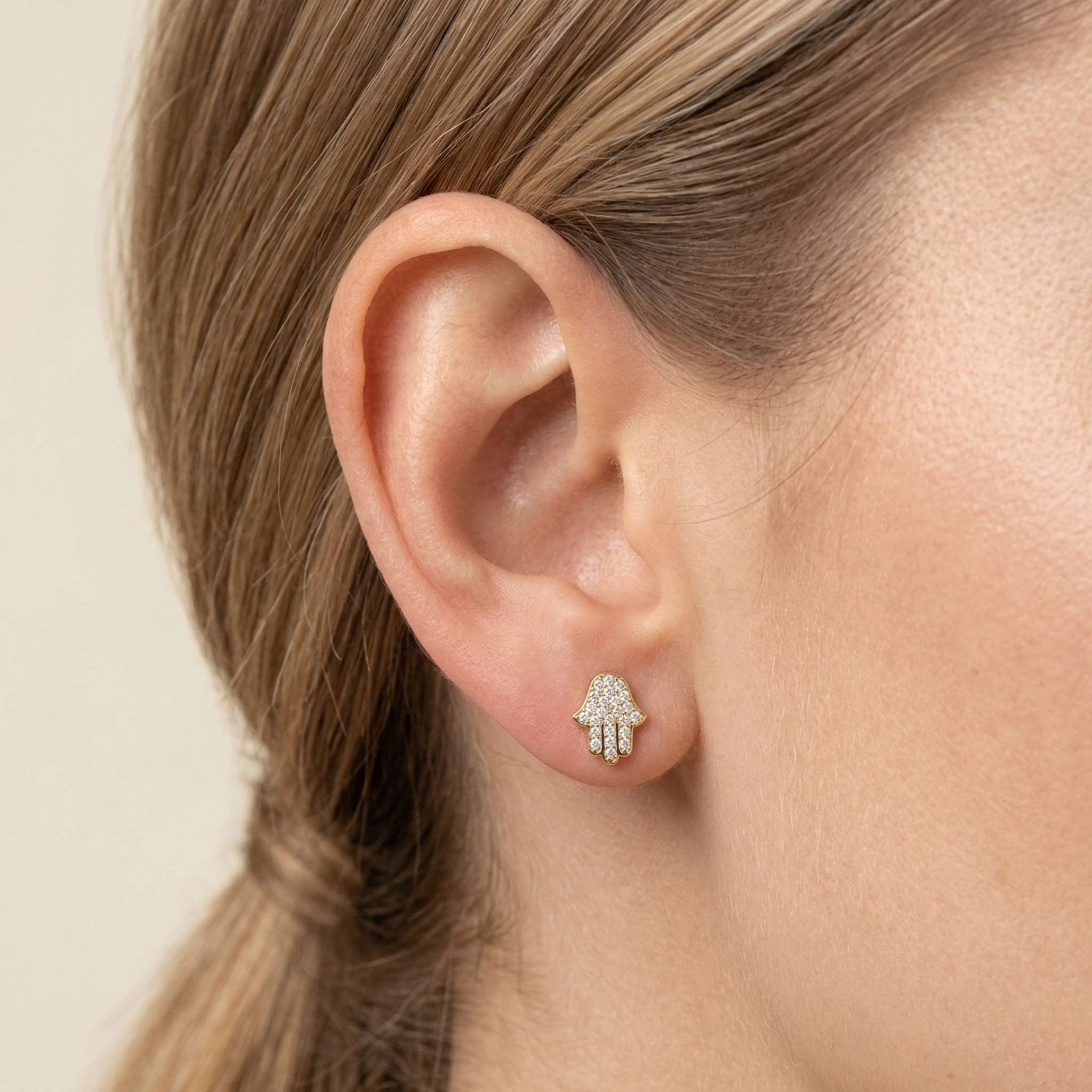 Dainty yellow gold Hamsa Hand studs 10mm height front view