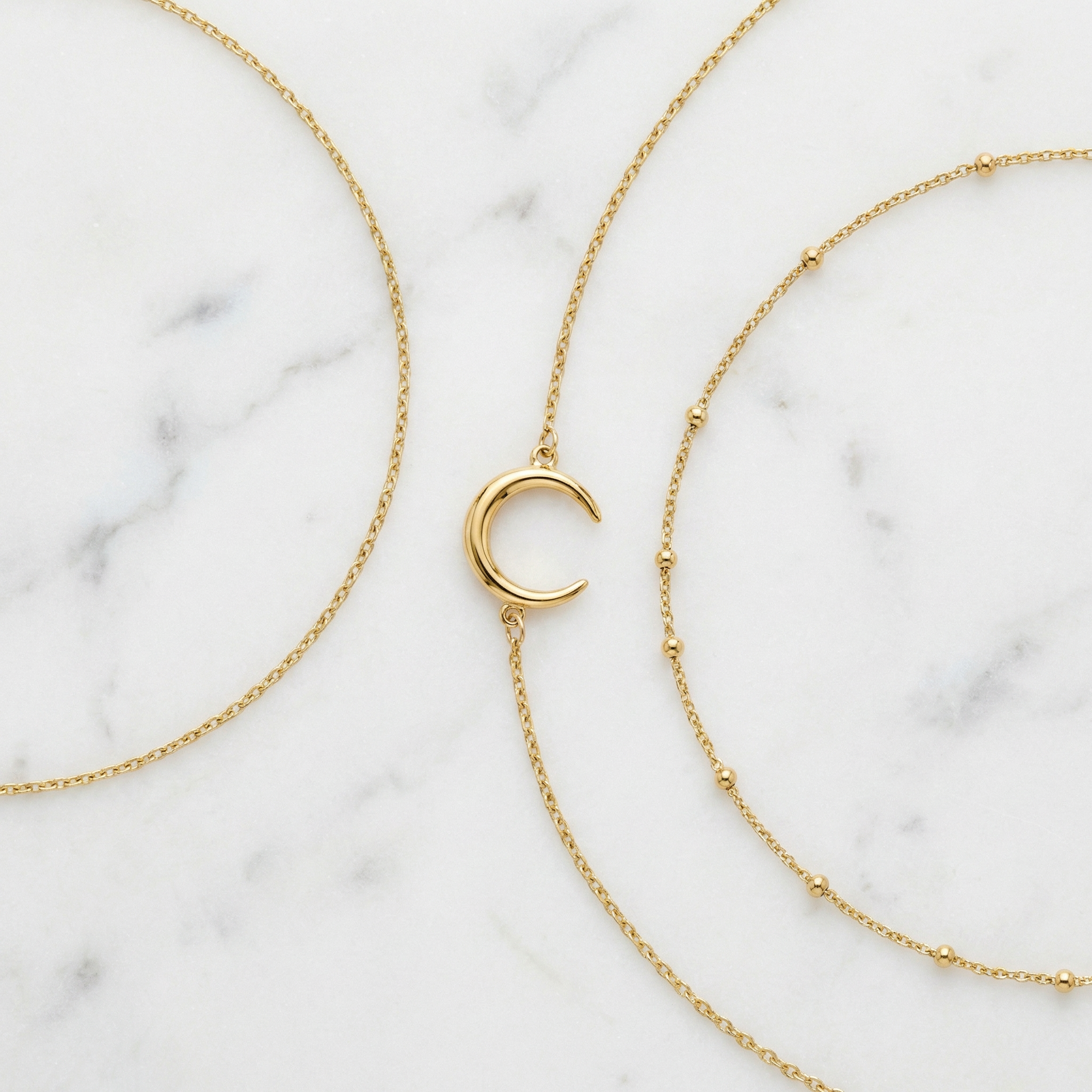 adjustable gold chain bracelet with crescent moon detail, minimal layering piece